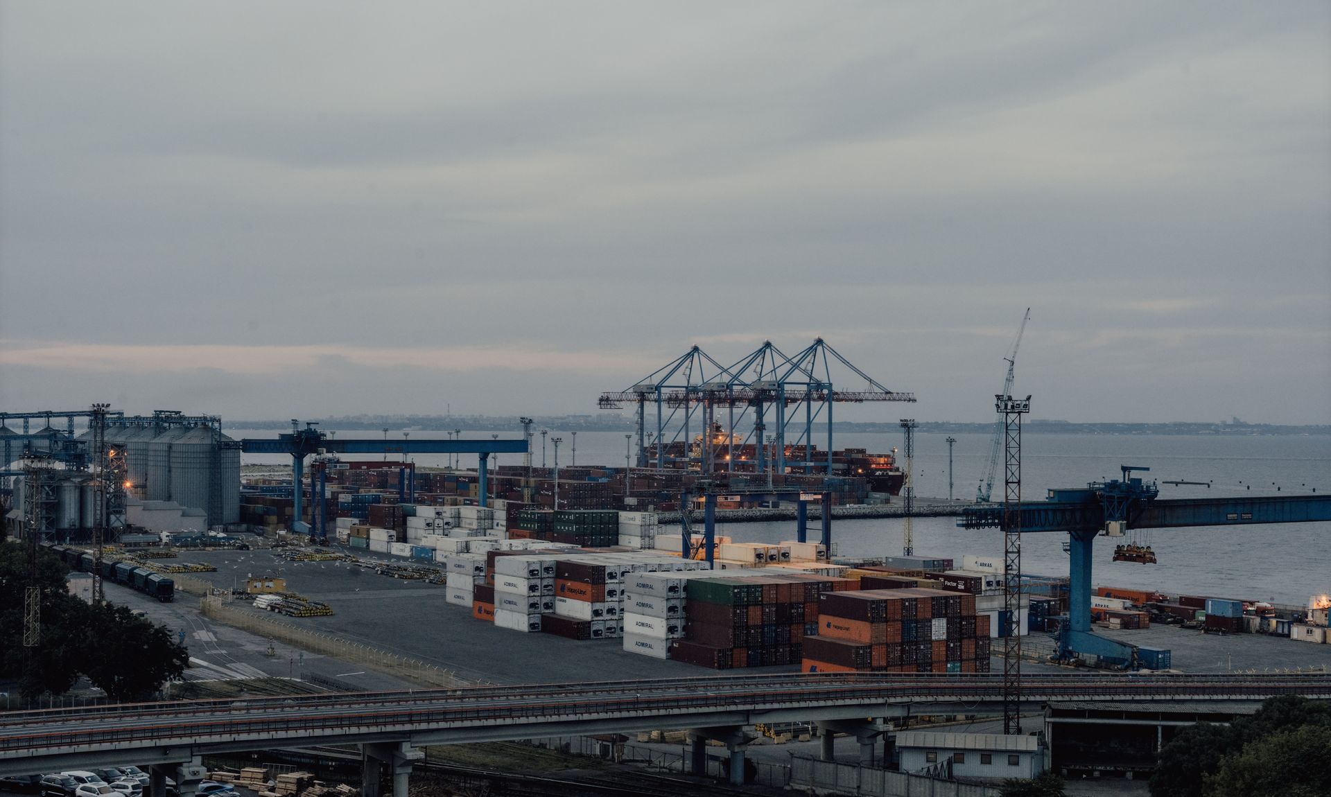 Black Sea container port at dusk — cranes, vessels and terminal infrastructure